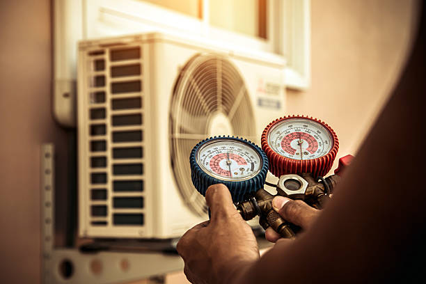 Professional Air Conditioning Service technician working in Fultonham, OH